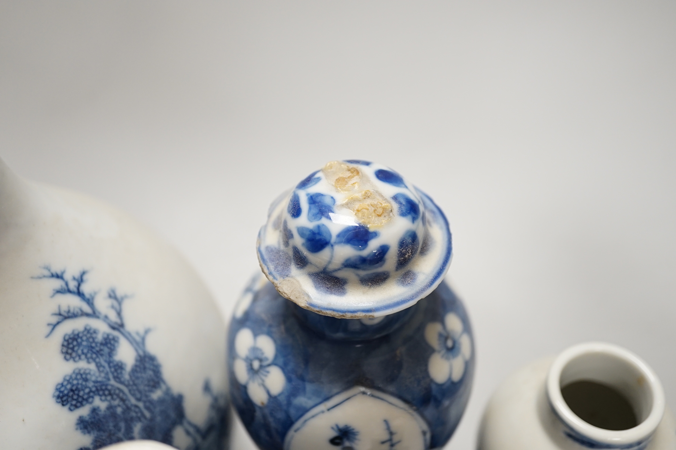 A Chinese armorial blue and white bottle vase, Qianlong/Jiaqing period, and five assorted 19th century Chinese blue and white vases, tallest 20cm; faults